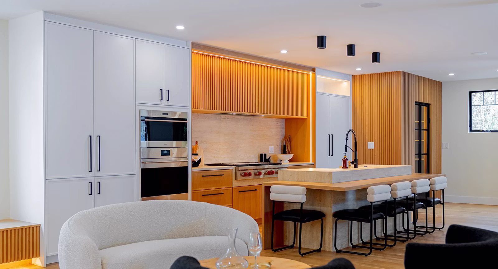 Modern kitchen with wood slat cabinetry and a stone island in South Jersey